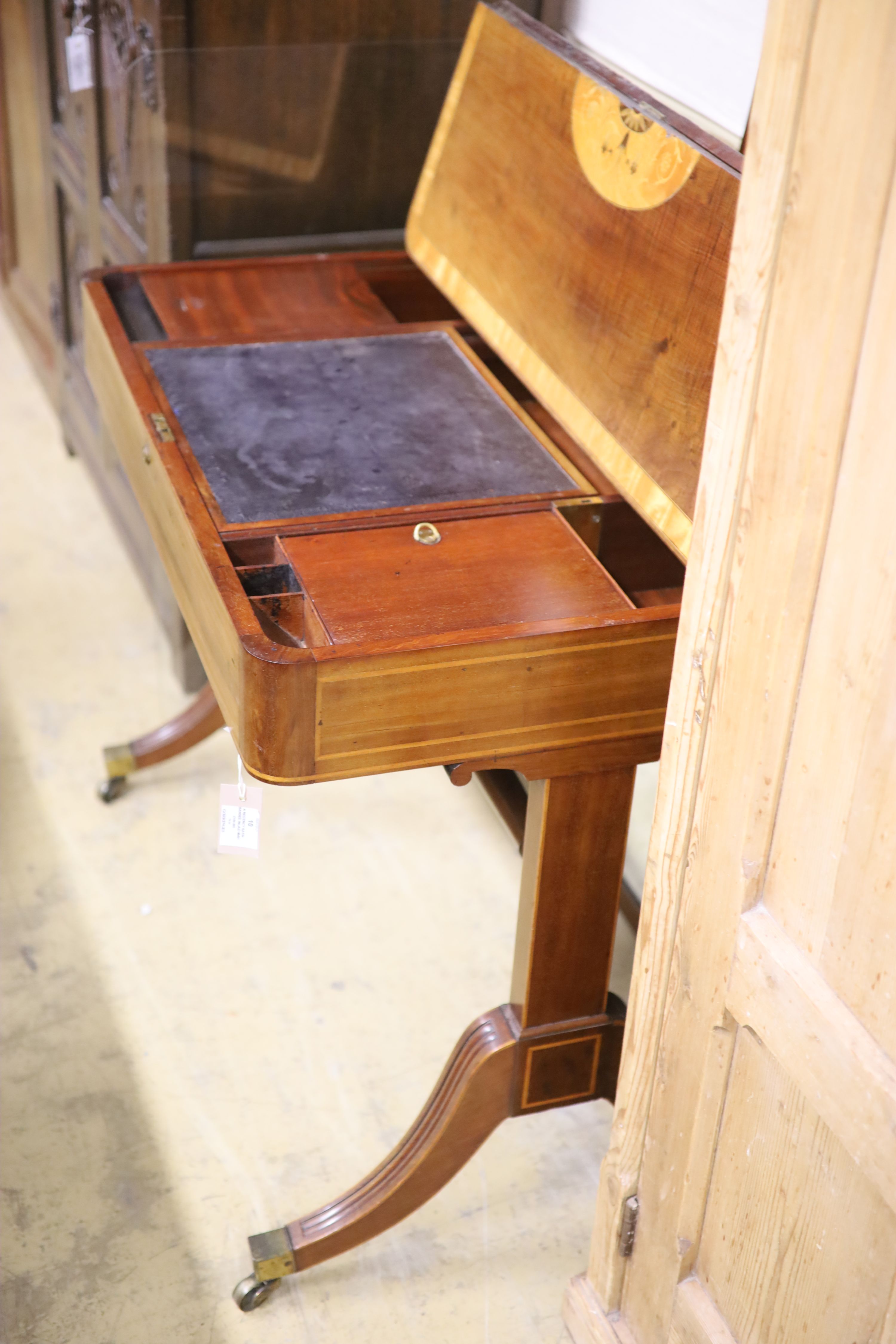 A Regency satin banded inlaid mahogany hinged top writing table, width 93cm depth 61cm height 75cm